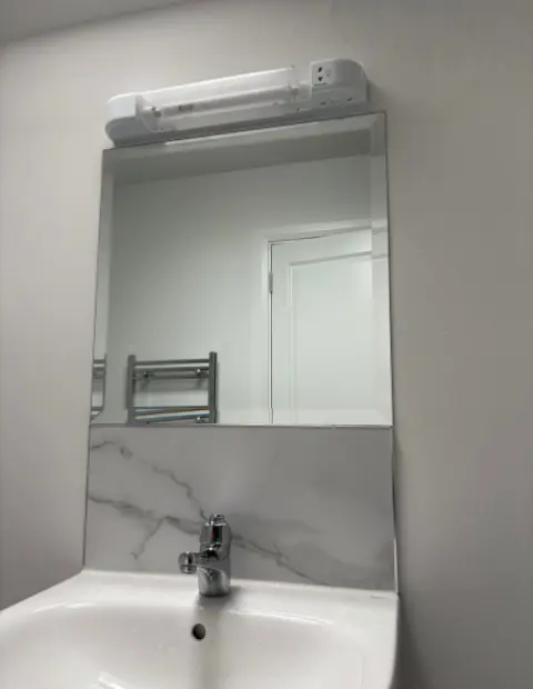 Custom bevelled bathroom mirror installed in a South Dublin home