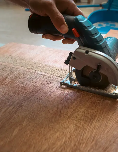 A wooden sheet being cut for the P Fahy Glazing Ltd window boarding up service in Wicklow and Dublin